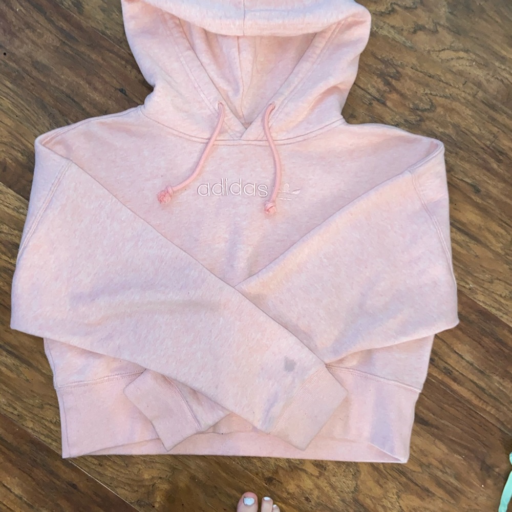 Woman’s cropped Adidas hoodie